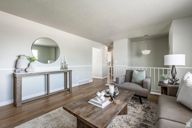 living area featuring wood finished floors and baseboards