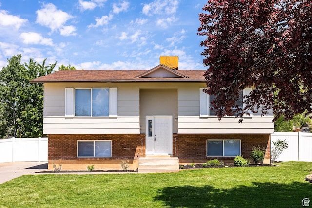bi-level home with brick siding