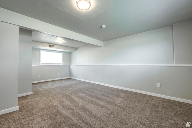 basement featuring carpet and baseboards