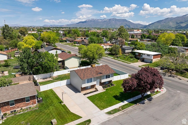 aerial view of residential area with a mountainous background