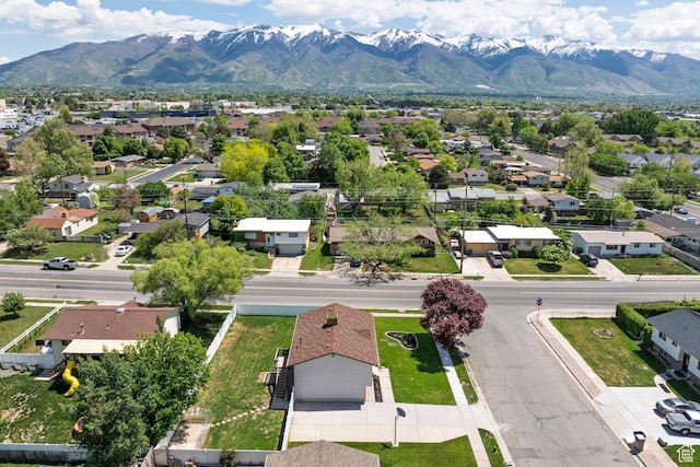 aerial view of residential area featuring a mountainous background