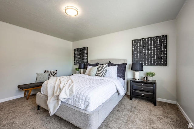 bedroom with carpet flooring and baseboards
