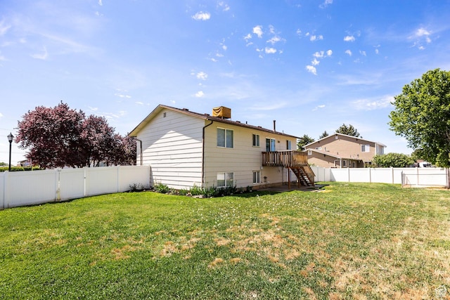 back of property featuring stairs and a deck