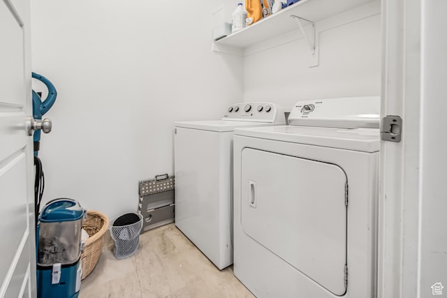 2994 S Tangent Peak Rd, Magna, UT 84044 - washroom with separate washer and dryer and light marble finish flooring