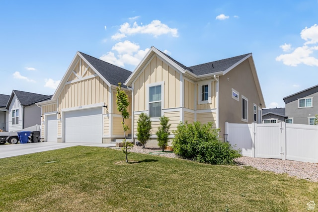 2994 S Tangent Peak Rd, Magna, UT 84044 - view of front of house featuring board and batten siding, a garage, concrete driveway, and a gate