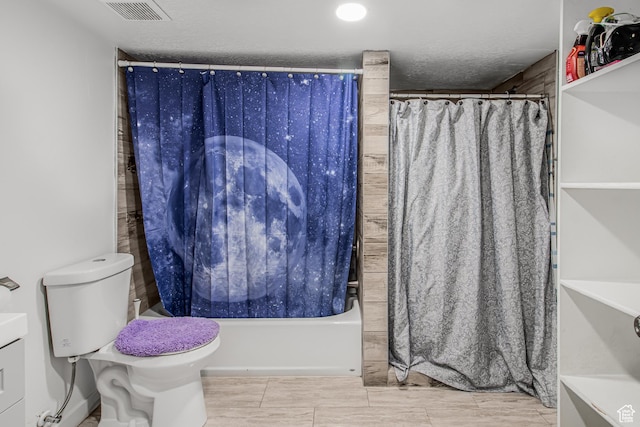 2994 S Tangent Peak Rd, Magna, UT 84044 - full bathroom featuring toilet, shower / bathtub combination with curtain, and a textured ceiling