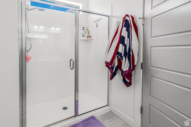 2994 S Tangent Peak Rd, Magna, UT 84044 - bathroom with marble finish flooring and a stall shower