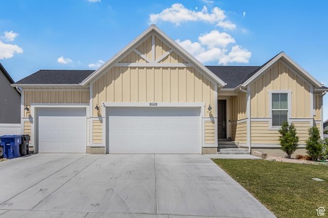 2994 S Tangent Peak Rd, Magna, UT 84044 - view of front of property with board and batten siding, a garage, and concrete driveway