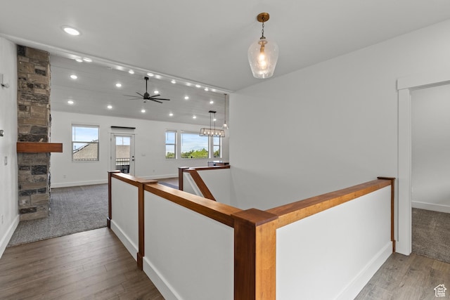 1885 N 2000 E, North Logan, UT 84341 - hallway with wood finished floors, an upstairs landing, recessed lighting, baseboards, and carpet flooring