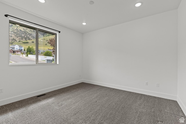 1885 N 2000 E, North Logan, UT 84341 - spare room with recessed lighting, baseboards, and dark colored carpet