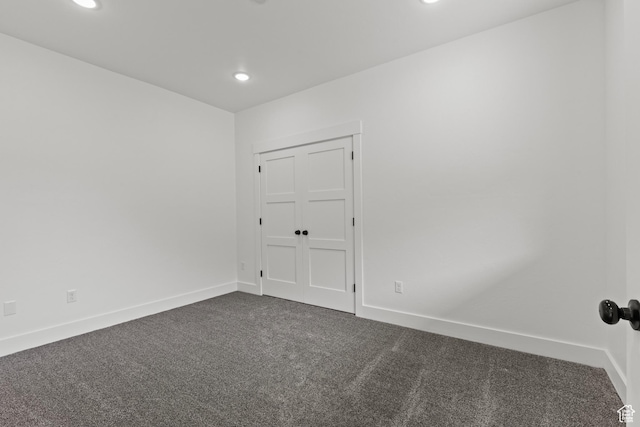 1885 N 2000 E, North Logan, UT 84341 - spare room with dark carpet, recessed lighting, and baseboards