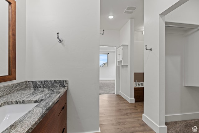 1885 N 2000 E, North Logan, UT 84341 - bathroom featuring vanity, baseboards, and wood finished floors