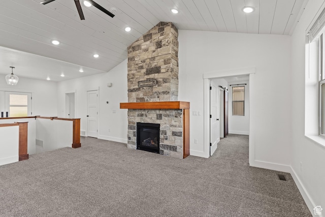 1885 N 2000 E, North Logan, UT 84341 - unfurnished living room featuring carpet flooring, recessed lighting, vaulted ceiling, a fireplace, and baseboards