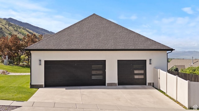 1885 N 2000 E, North Logan, UT 84341 - view of side of home with a mountain view, roof with shingles, and stucco siding