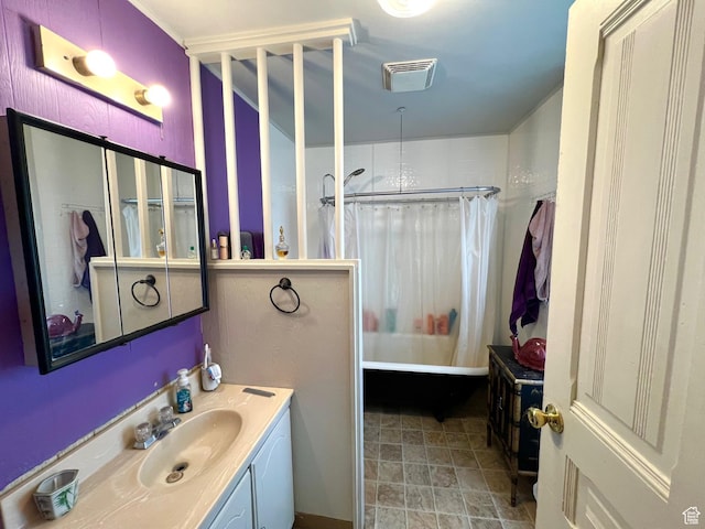 bathroom with shower / bath combo with shower curtain and vanity