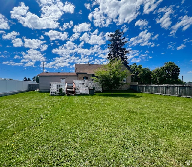 view of yard with a deck