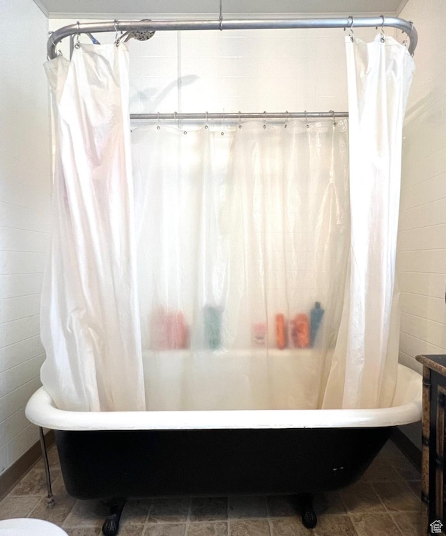 bathroom with shower / bathtub combination with curtain