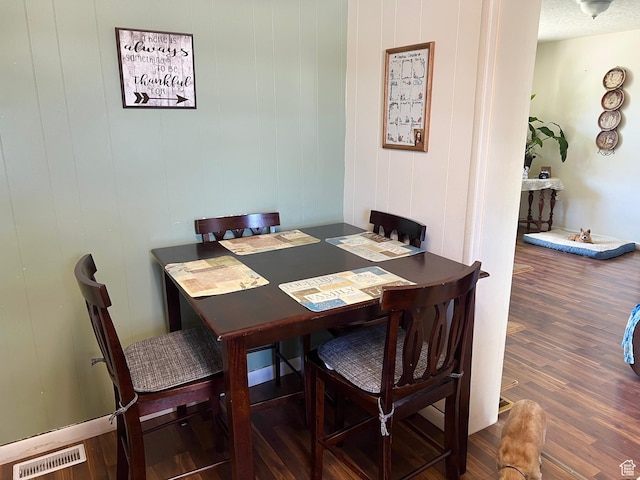 dining space featuring wood finished floors