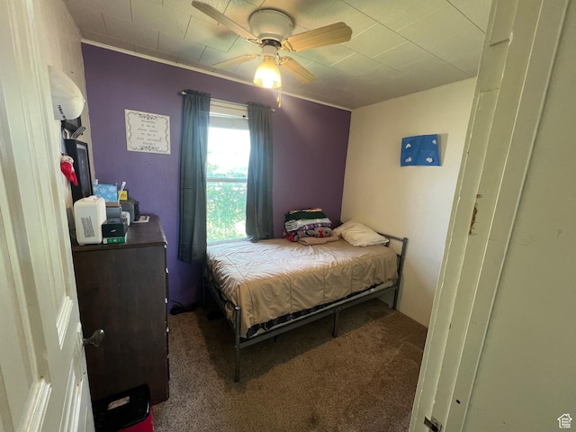 bedroom featuring carpet flooring, ceiling fan, and ornamental molding