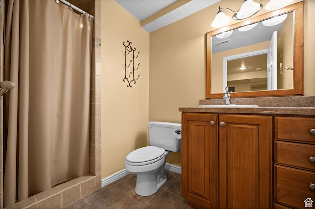full bath with toilet, tile patterned floors, vanity, and tiled shower