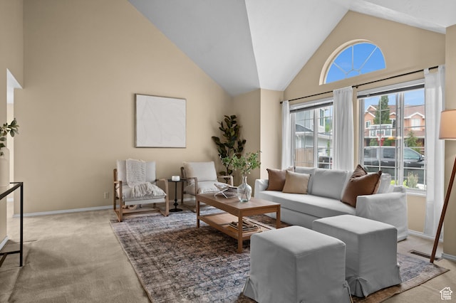 living area with carpet, high vaulted ceiling, and baseboards