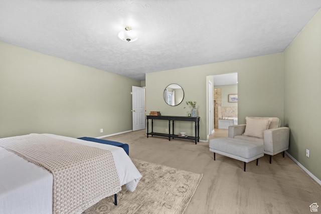 carpeted bedroom with baseboards and a textured ceiling