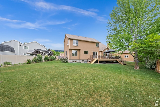 back of house with stairs, a deck, and stucco siding