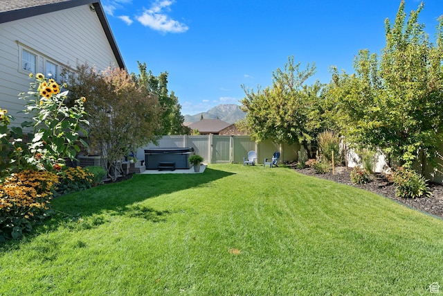 5982 N Rollins Ranch Rd W, Mountain Green, UT 84050 - view of yard featuring a hot tub and a mountain view
