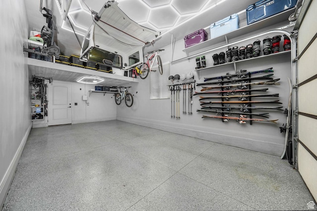 5982 N Rollins Ranch Rd W, Mountain Green, UT 84050 - garage featuring baseboards