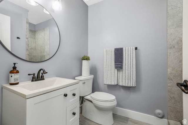 5982 N Rollins Ranch Rd W, Mountain Green, UT 84050 - bathroom featuring wood finished floors, vanity, and a tile shower