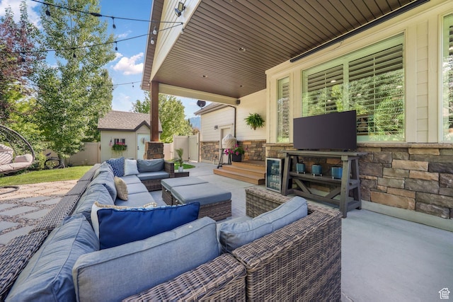 5982 N Rollins Ranch Rd W, Mountain Green, UT 84050 - view of patio featuring outdoor lounge area and an outdoor structure