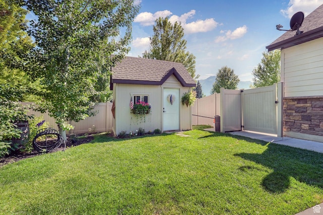 5982 N Rollins Ranch Rd W, Mountain Green, UT 84050 - fenced backyard with a shed and a gate