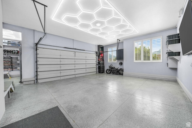 5982 N Rollins Ranch Rd W, Mountain Green, UT 84050 - garage featuring baseboards
