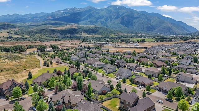 5982 N Rollins Ranch Rd W, Mountain Green, UT 84050 - aerial view of residential area featuring a mountain backdrop
