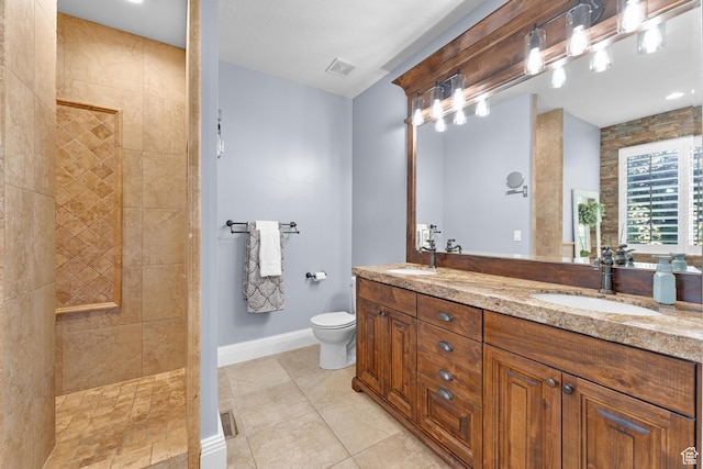 5982 N Rollins Ranch Rd W, Mountain Green, UT 84050 - full bathroom with a walk in shower, double vanity, toilet, baseboards, and tile patterned flooring