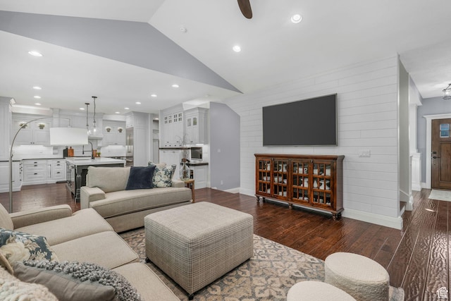 5982 N Rollins Ranch Rd W, Mountain Green, UT 84050 - living room featuring lofted ceiling, dark wood finished floors, wooden walls, a ceiling fan, and recessed lighting