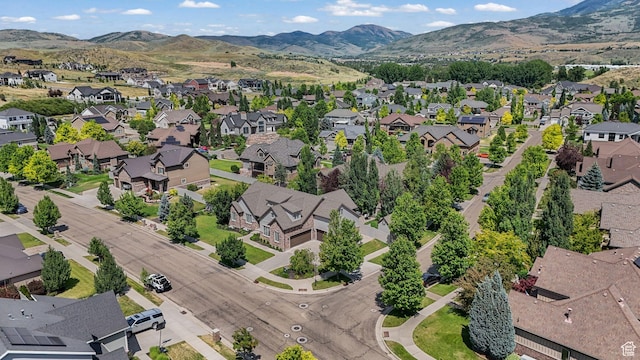 5982 N Rollins Ranch Rd W, Mountain Green, UT 84050 - aerial perspective of suburban area featuring a mountain backdrop