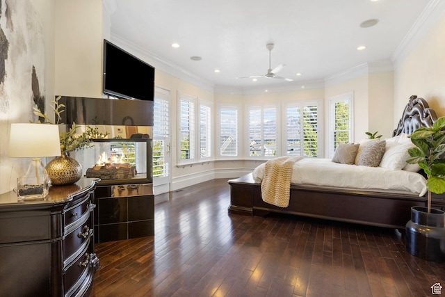 bedroom featuring dark wood-type flooring, ornamental molding, recessed lighting, and baseboards