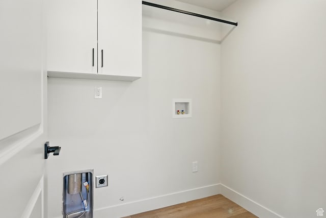 732 S Liberty Dr S, Cedar City, UT 84720 - washroom with hookup for an electric dryer, cabinet space, hookup for a washing machine, light wood finished floors, and baseboards