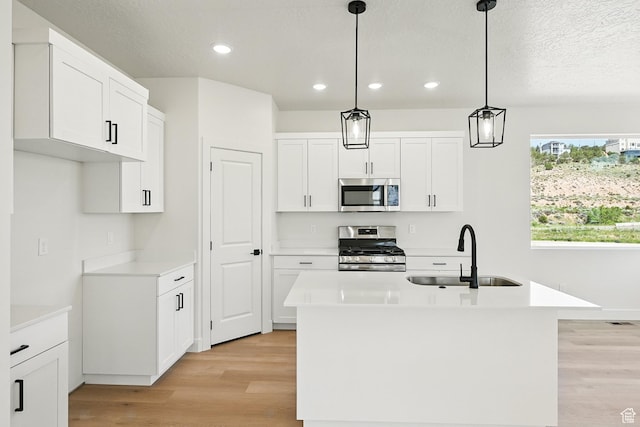 732 S Liberty Dr S, Cedar City, UT 84720 - kitchen with appliances with stainless steel finishes, a sink, light wood finished floors, recessed lighting, and light countertops