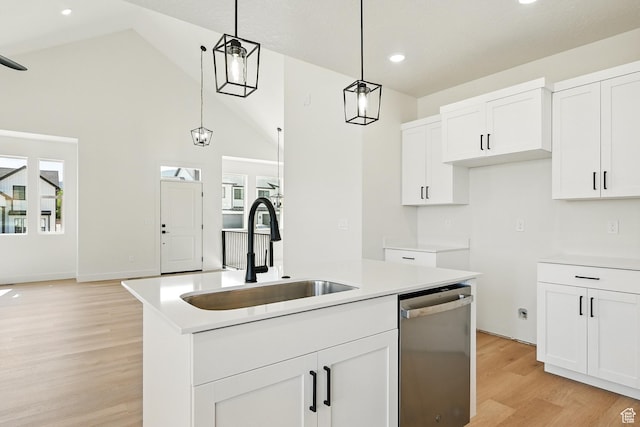 732 S Liberty Dr S, Cedar City, UT 84720 - kitchen featuring dishwasher, a sink, light wood-style floors, hanging light fixtures, and white cabinetry