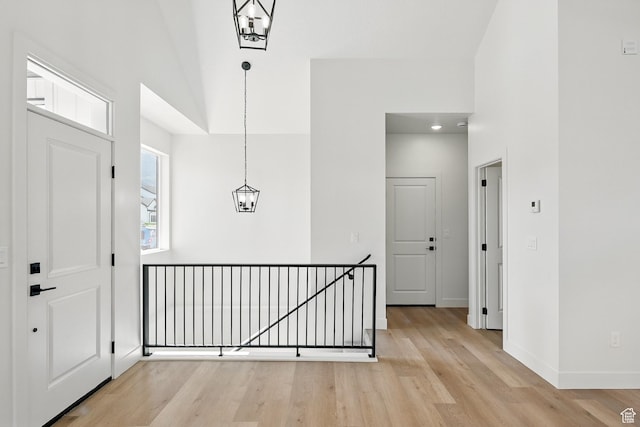 732 S Liberty Dr S, Cedar City, UT 84720 - entrance foyer with a high ceiling, light wood-type flooring, baseboards, and a chandelier