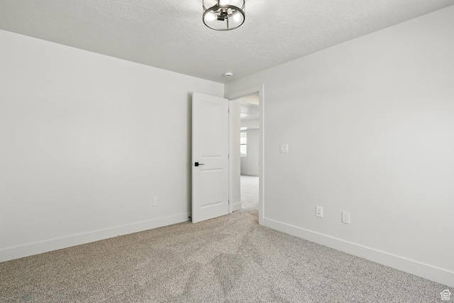 732 S Liberty Dr S, Cedar City, UT 84720 - carpeted spare room with a textured ceiling, baseboards, and a smoke detector