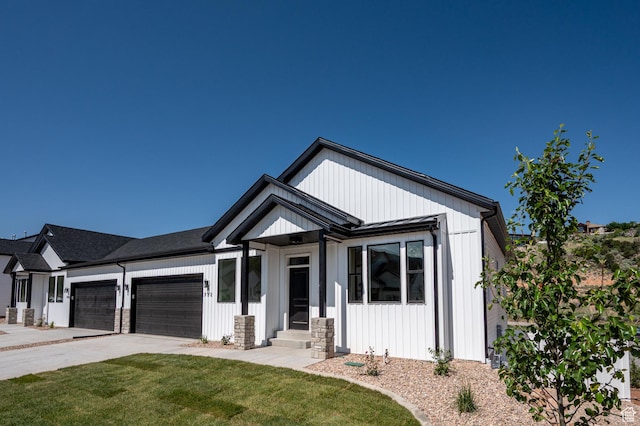 732 S Liberty Dr S, Cedar City, UT 84720 - modern farmhouse style home with a garage, a front yard, driveway, entry steps, and board and batten siding