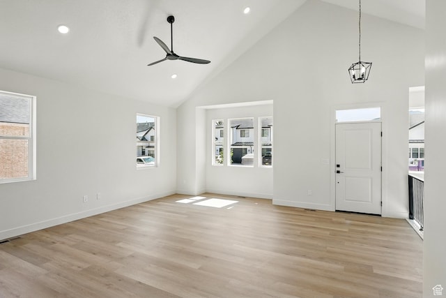 732 S Liberty Dr S, Cedar City, UT 84720 - foyer entrance featuring high vaulted ceiling, plenty of natural light, light wood-type flooring, ceiling fan, and a chandelier
