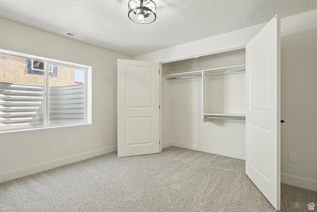 732 S Liberty Dr S, Cedar City, UT 84720 - unfurnished bedroom featuring a textured ceiling, carpet flooring, a closet, and baseboards