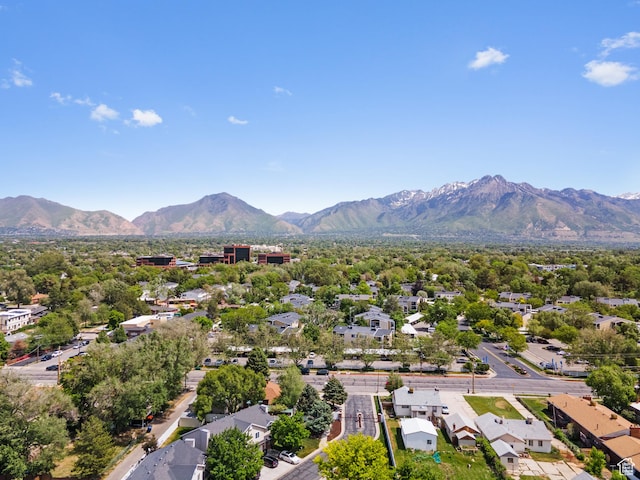 aerial view of residential area featuring a mountainous background