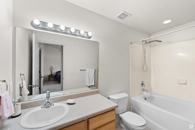 full bath with toilet, vanity, and tub / shower combination