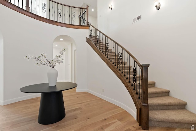 3134 S 355 W, Washington, UT 84780 - stairs with wood finished floors, baseboards, arched walkways, and a towering ceiling