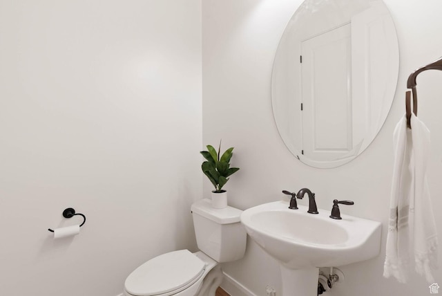 3134 S 355 W, Washington, UT 84780 - half bathroom with toilet, baseboards, and a sink